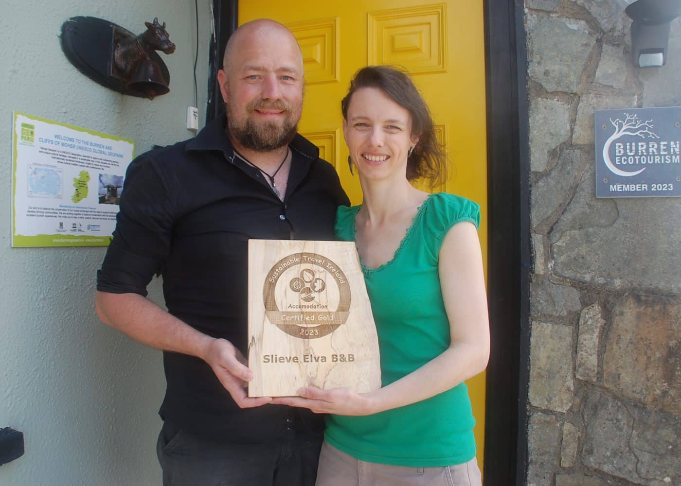 Slieve Elva owners holding their Sustainable Travel Ireland Gold Certification award 2023