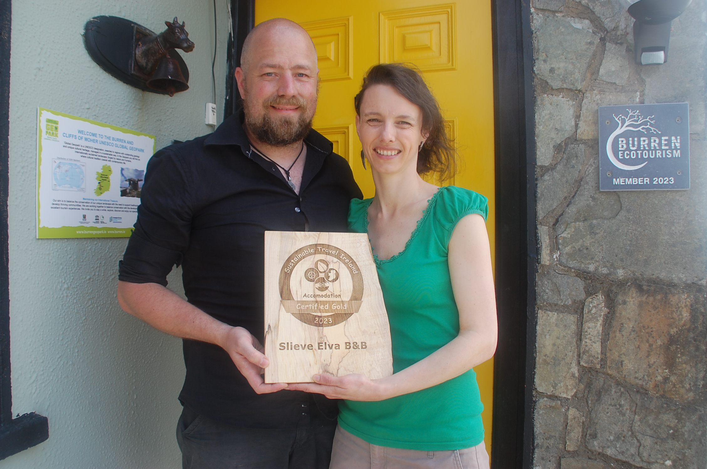 Slieve Elva owners holding their Sustainable Travel Ireland Gold Certification award 2023